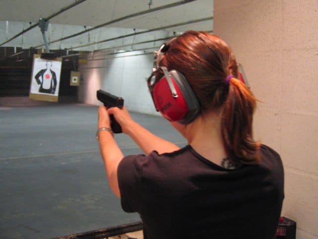 A woman aiming