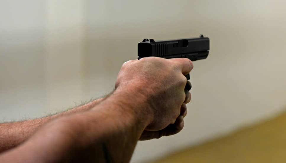 man shooting with a gun