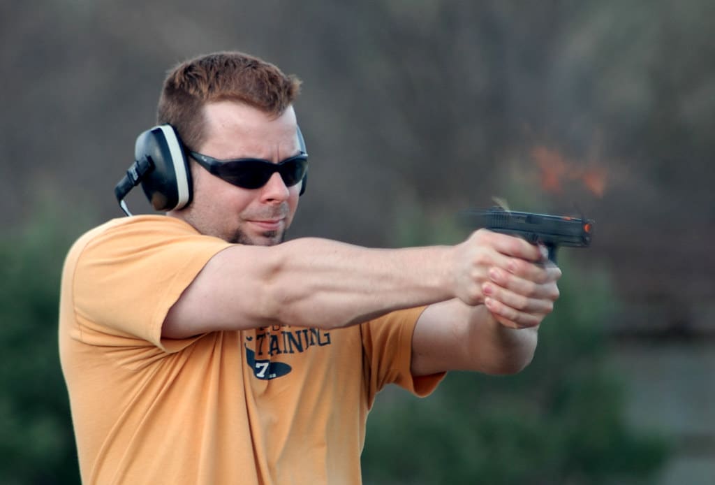 a man shooting with Glock