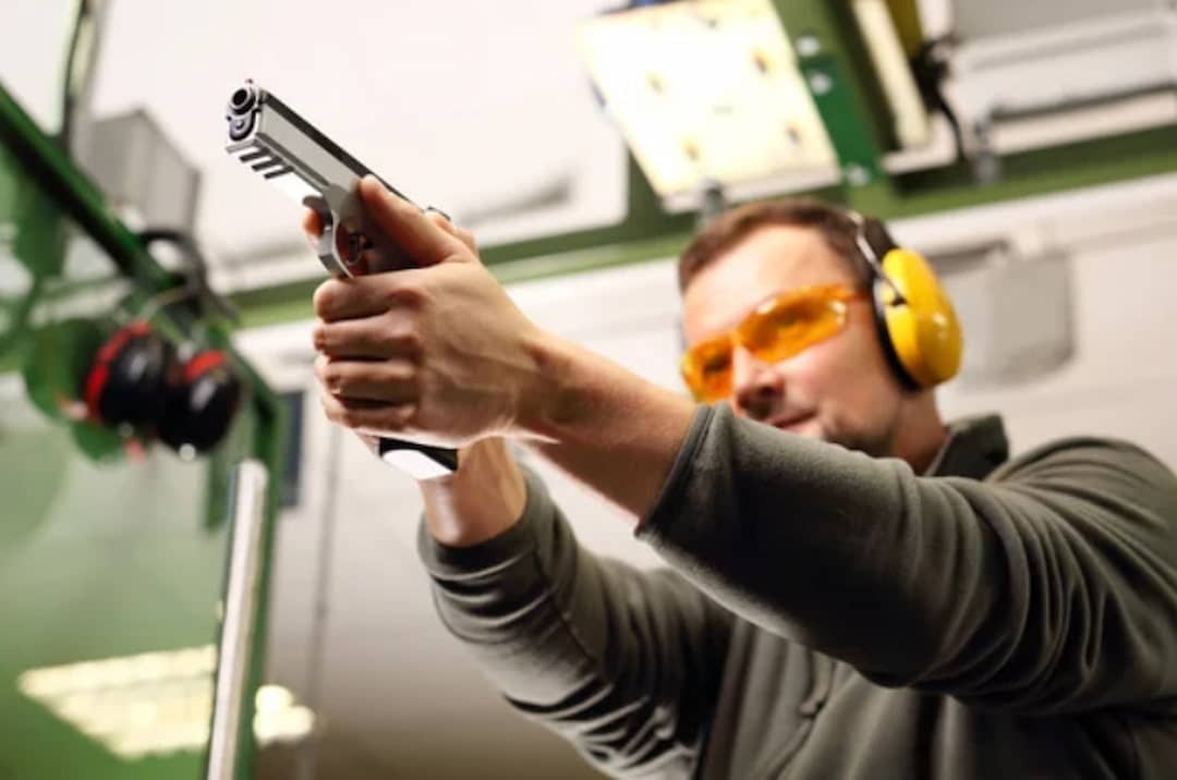 a person shooting at the gun range