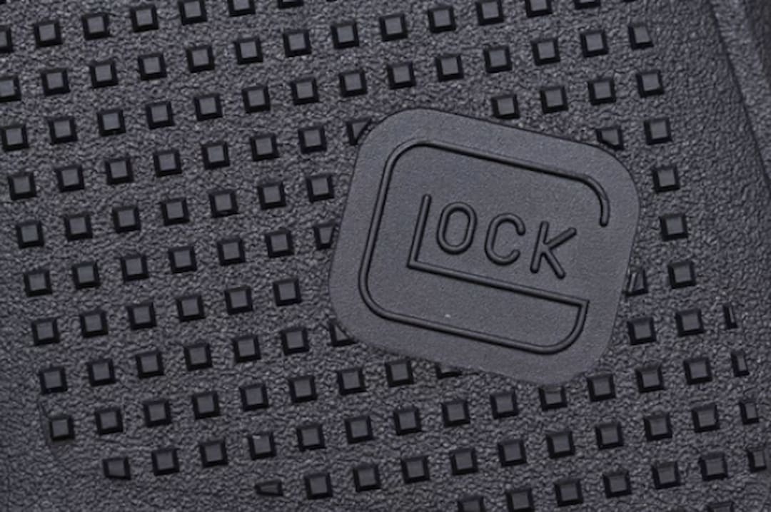 closeup of the Glock logo on the pistol