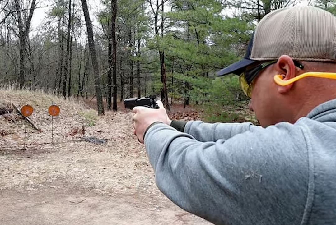 a person shooting with Remington