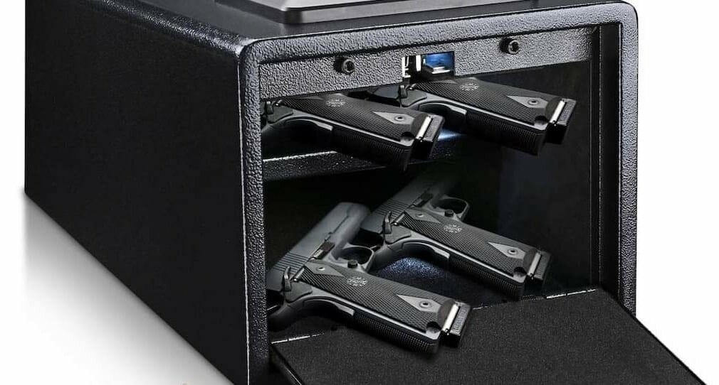 four guns in a black safe