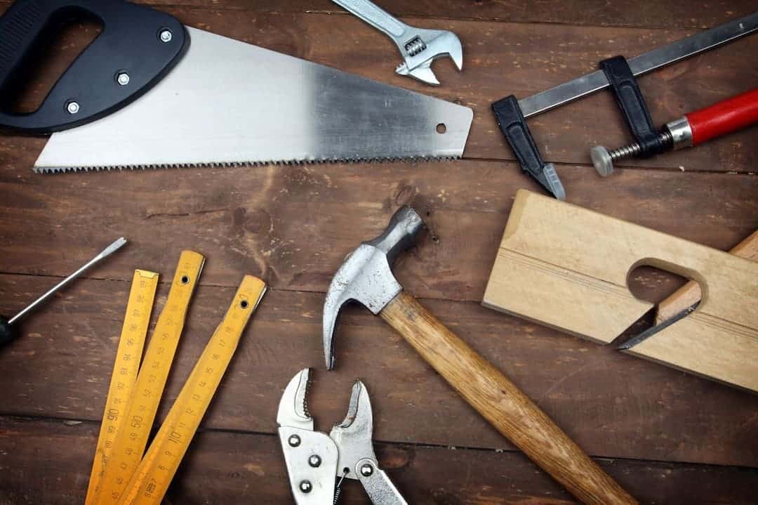 Various tools on wooden desk
