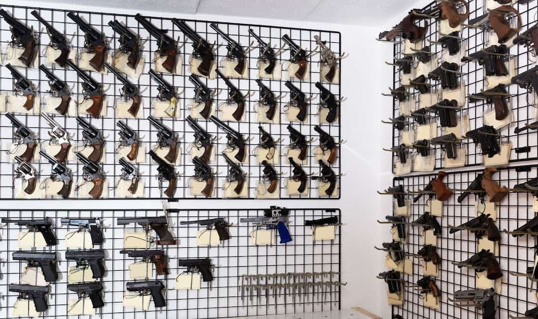 Handguns on a rack in firearms store