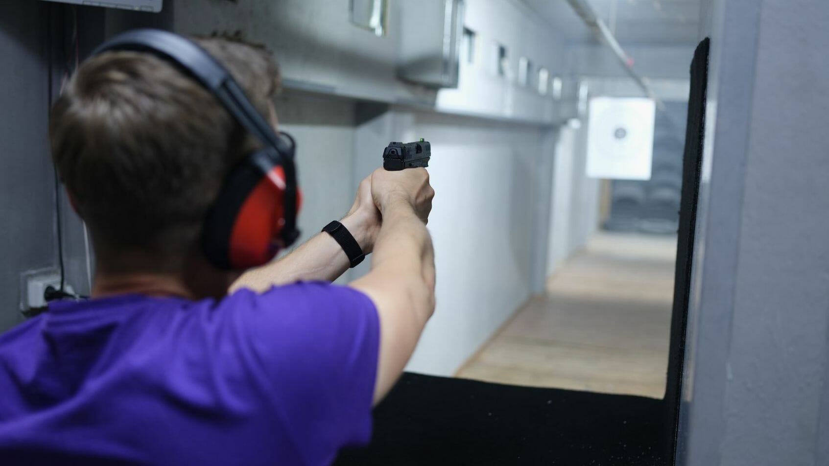 A person aiming at the shooting range