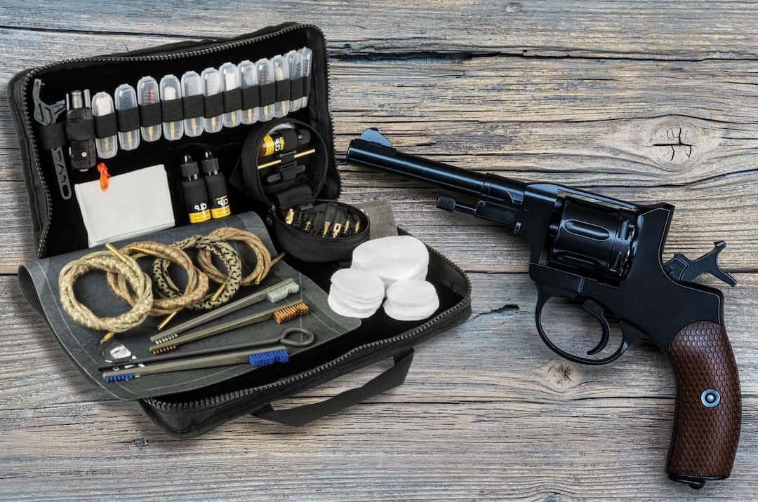 A revolver next to the cleaning kit