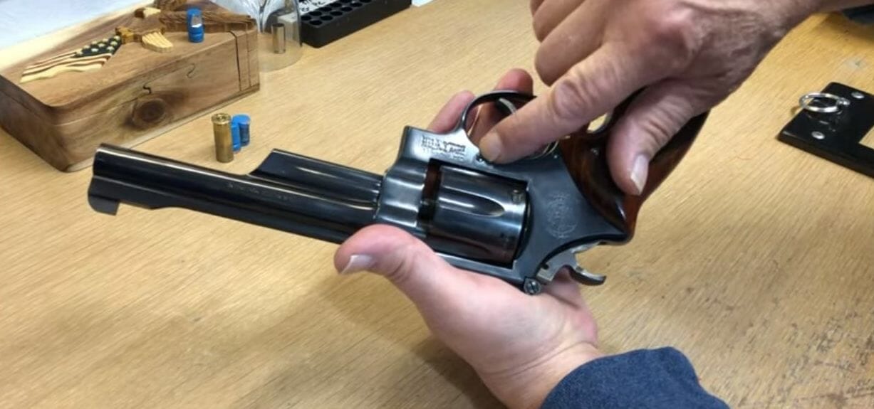 A person showing the revolver